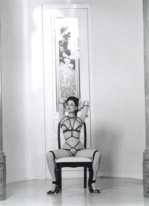 Naked and tied to a chair