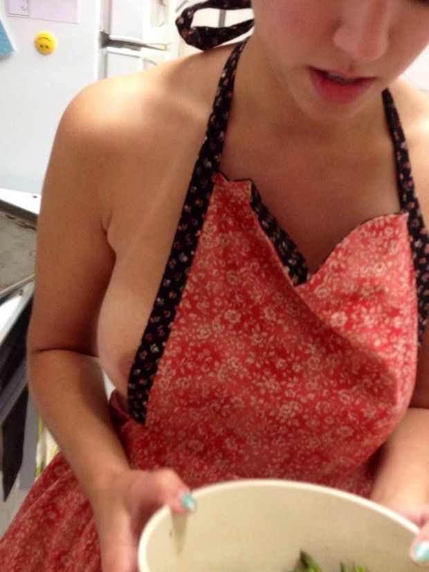 Boob peeks out of her apron …