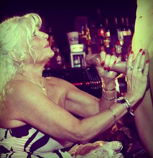 Superb blonde jugs in incredible handjob photo