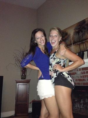 two sexy sluts at a party, one showing off her ass in spandex