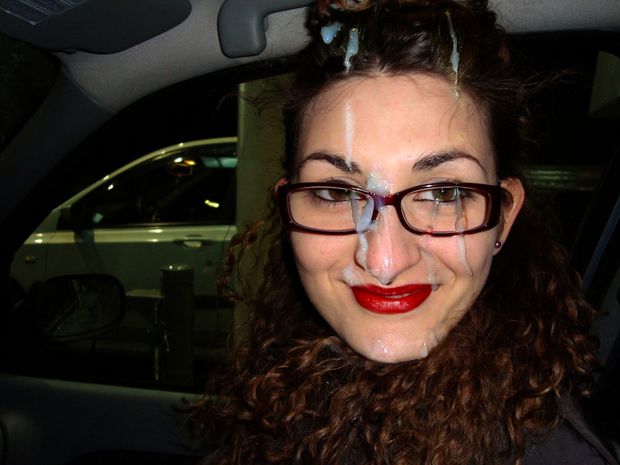 Girl with bright red lipstick driving in the car with cum all over her face and hair