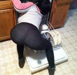 Young teen girl in tight leggings bend over