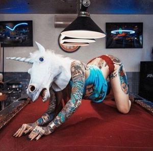 Unicorn on the pool table. Of course.