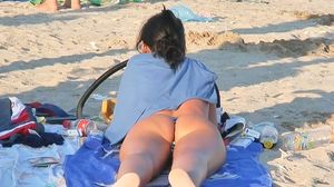 Pretty topless bikini girls are running on the beach shamelessly shaking the stripped billibongs