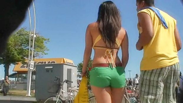 Chick is demonstrating body wrapped in no thing but bikini bra and the diminutive booty pants