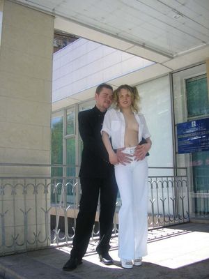 Busty blonde is undressing near government building