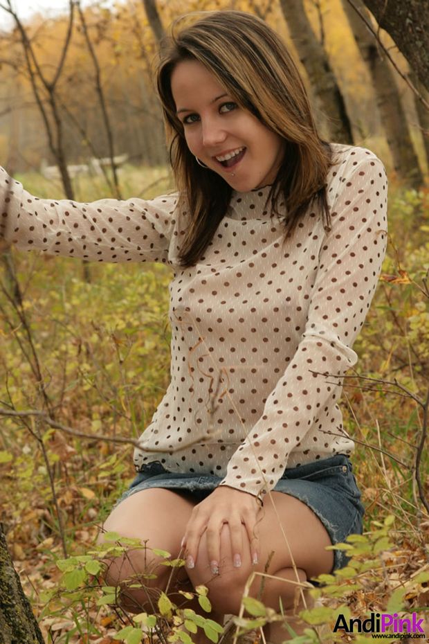 Andi Pink pulls down her jean skirt