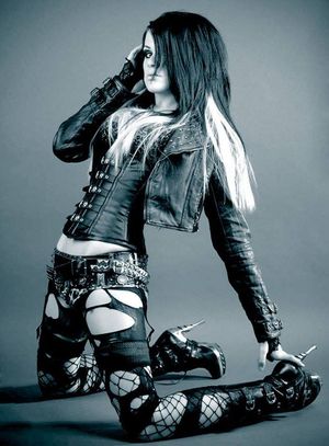 Cute emo girls, so breathtaking and sexy. Decked out in long leather buckled boots with high heels. How erotic when they stand erect, beautiful shapely legs covered with black fishnet stockings. The tight leather vest covering the buxom chest. The black a