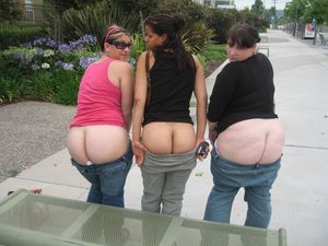 Three beautiful ladies showing off their bare bottoms