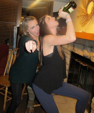 two sexy drunk girls at a party