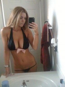 MyFreeCams Niki Skyler taking a sultry bikini selfshot fully clothed