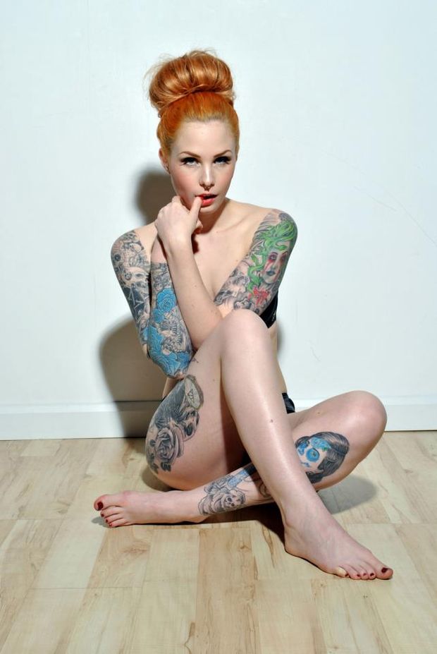 Leanne James covering her nude body
