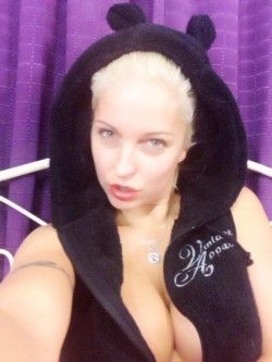 Biggi Bardot cleavage selfy fully clothed