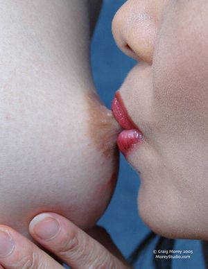 sucking at her nipple