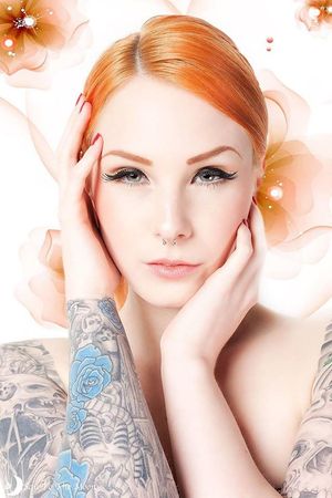 Leanne James is one sexy tattooed redhead.