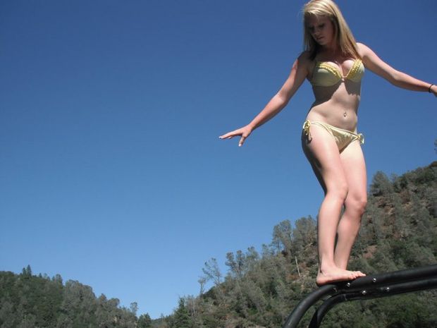 slutty girl with perfect perky tits showing off her sexy body at the lake