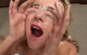 Collecting cum on her face into her thirsty mouth