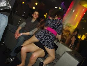 Partying girl showing skin pantyhose under her short…
