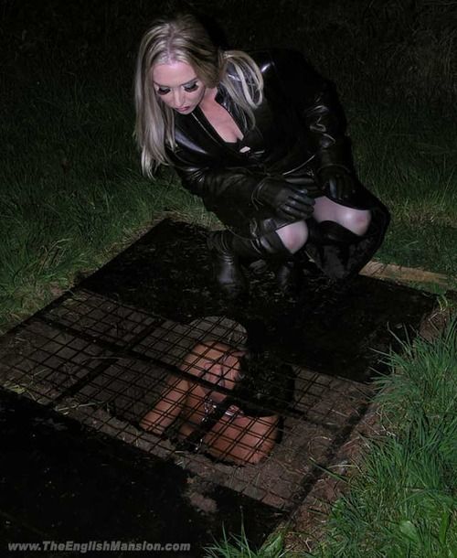 Mistress Sidonia spitting on her caged slave