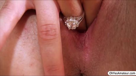 Red head babe Ariella gives pleasure to her cherry pussy