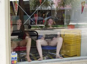 Two college girls spreading in the window