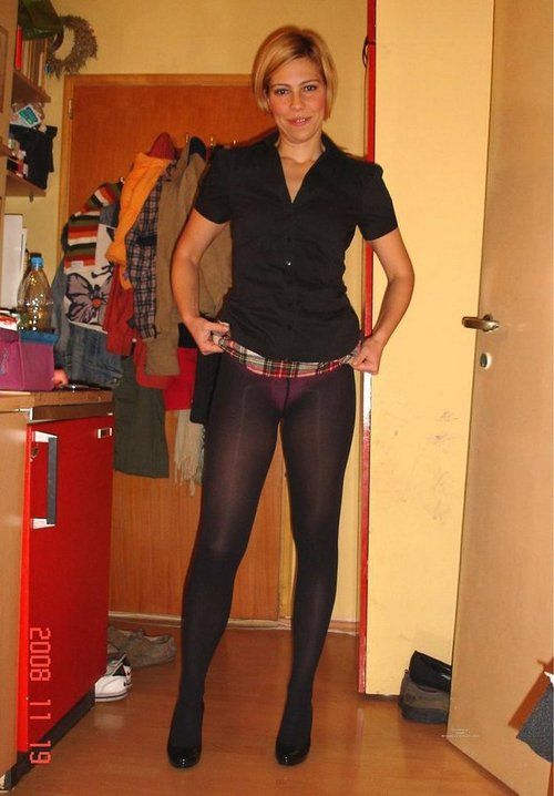 Girlfriend showing panties under black pantyhose. Woman...