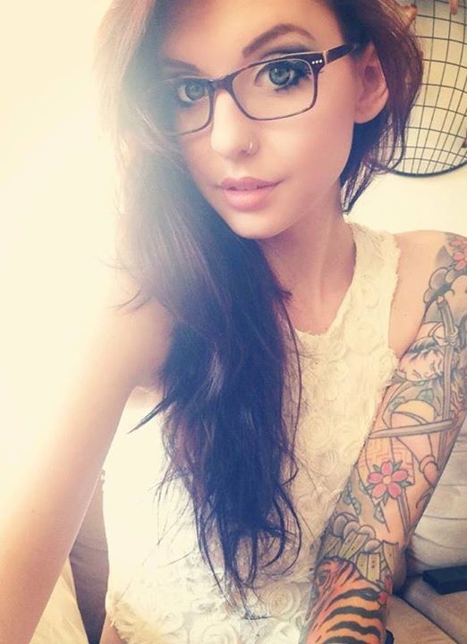 Nerdy emo girl looking all cute in her glasses