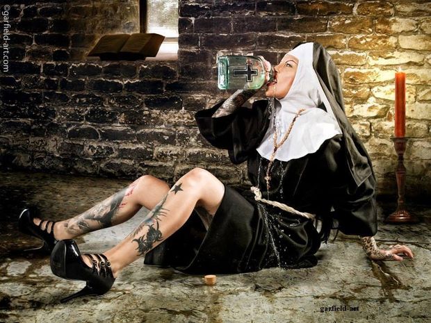 Sexy tattoed nun drinking