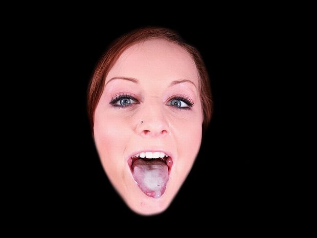 Redhead babe showing cum on her tongue