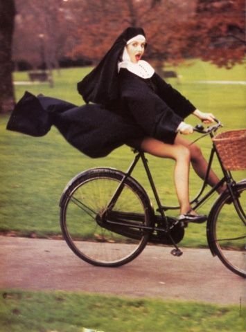 There were 5 nuns on a Sunday afternoon in Paris ridin a 5 seated bike...