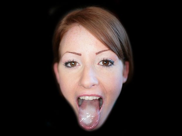 Redhead babe showing cum on her tongue