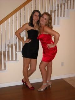 two slutty girls in tight dresses posing at a party