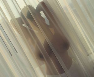 Help! There's a busty ghost behind the curtains!