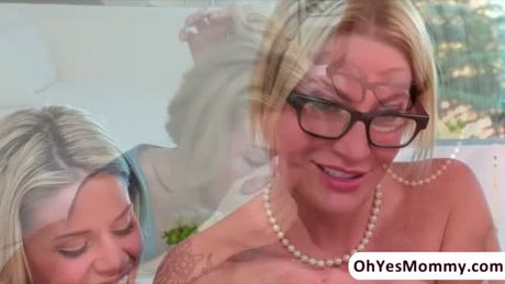 Super hot blonde babe Jenna Rhodes is horny and wants sex with her BF but he is working. She ends up making out with her stepmom.