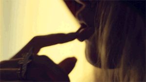 Sensual blonde licking her finger