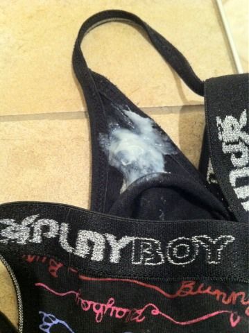 her black panties filled with thick creamy grool