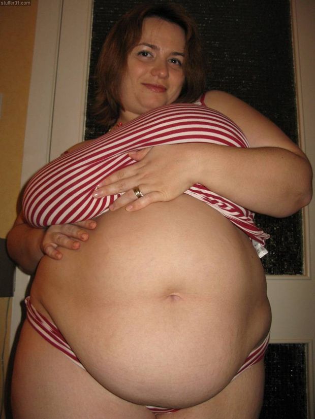 Busty BBW Mom showing off her round belly