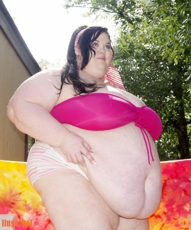 Beautiful girl with a huge hanging belly
