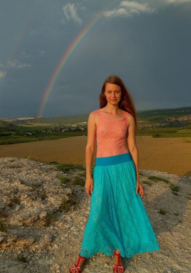 Very sweet girl and a rainbow