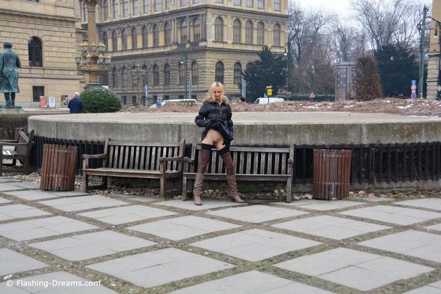 Blonde with boots showing her shaved pussy