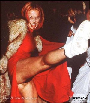 Spice Girl Geri Halliwell in a red dress upskirt photo