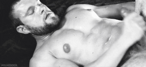 Gorgeous stud cumming while masturbating his virile cock