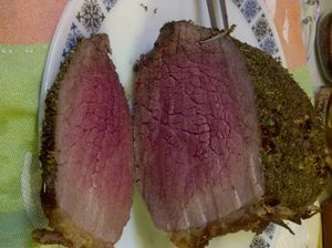 Medium-rare beef is mostly bright pink from centre outward with no red and grey-brown on edges. The meat is tender, juicy, and flavourful