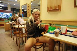 legs apart eating fries