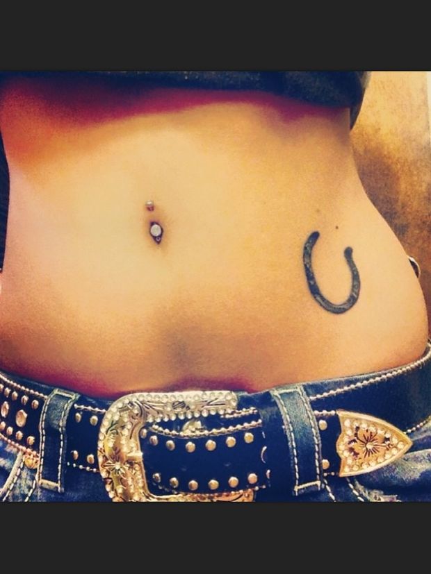 Cowgirl with lucky horseshoe tattoo