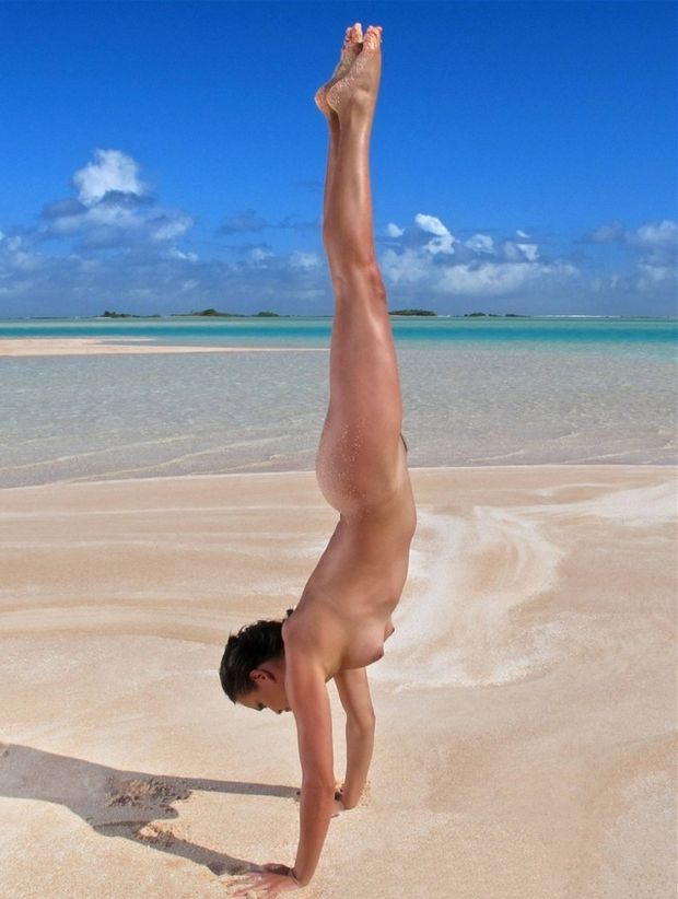 Hand stand on beach