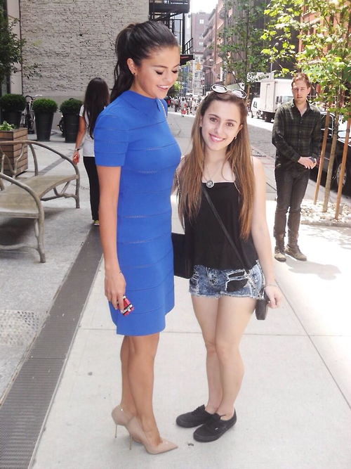 Selena Gomez Pokies in a tight blue dress