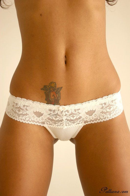 Polliana strips down to her white panties and bends over
