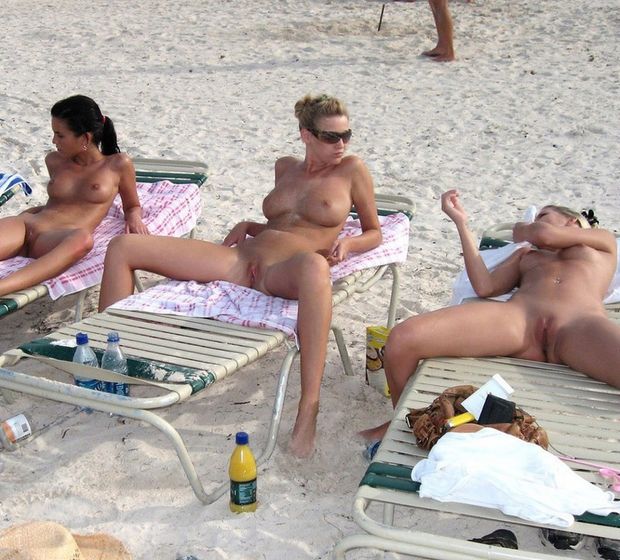 Summer attraction beautiful topless girls on the beach.