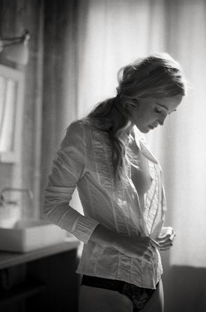 sweet perky blonde breasts buttoning white shirt